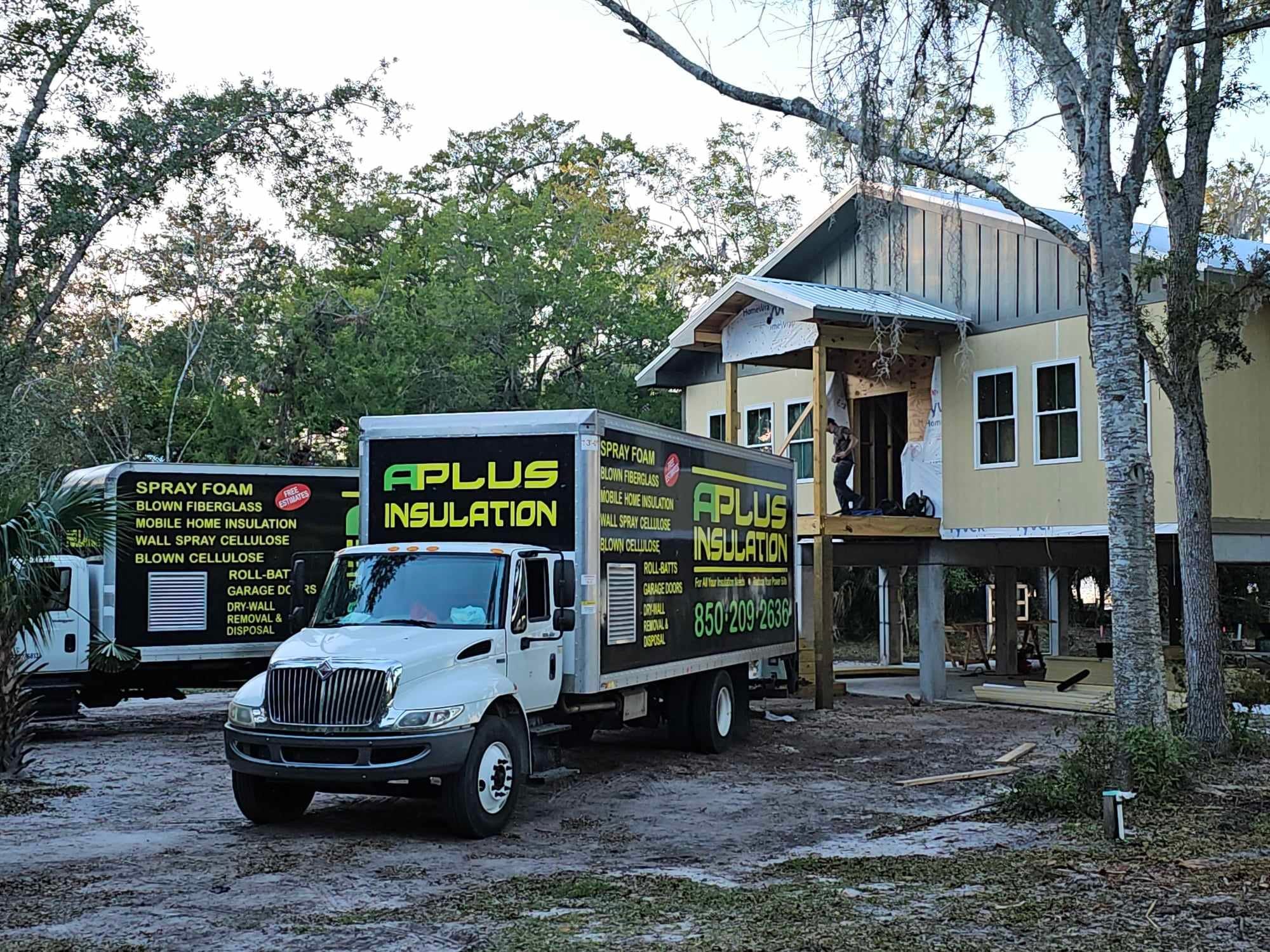 A Plus Insulation truck and equipment on a job site along Hwy 90 in Marianna